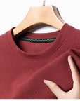Men's Casual Waffle Knit Short Sleeve T-Shirt Round Neck Design.