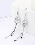 Elegant 925 Sterling Silver Hollow Leaf Flower Drop Earrings - Long, stylish jewelry for women. Perfect for any occasion!