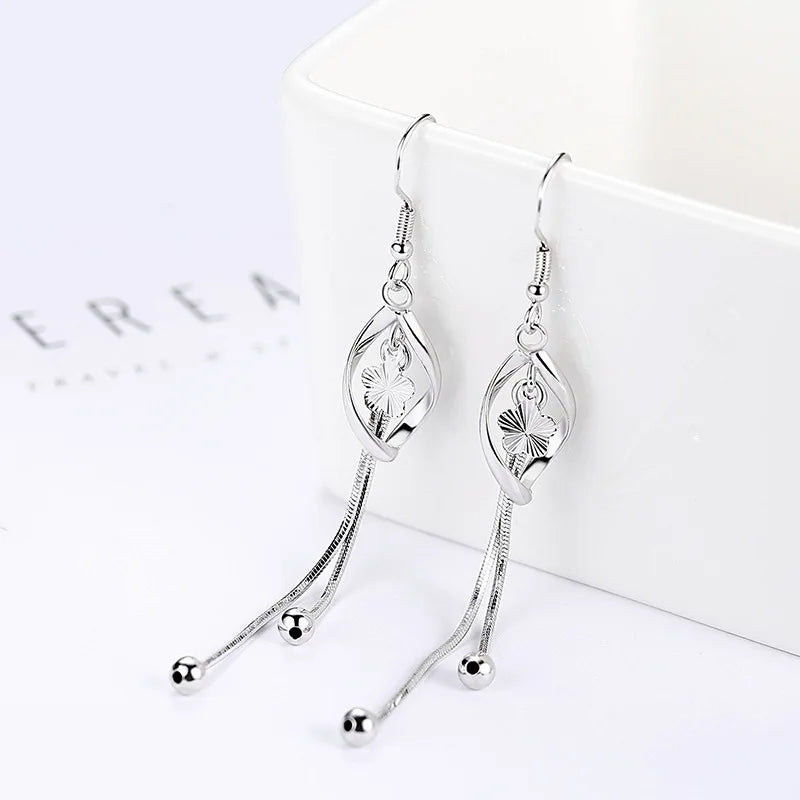 Elegant 925 Sterling Silver Hollow Leaf Flower Drop Earrings - Long, stylish jewelry for women. Perfect for any occasion!